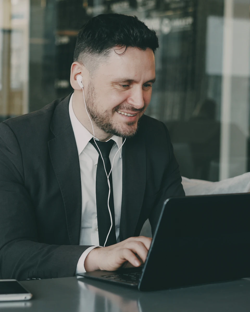 A learner working through a course on a laptop